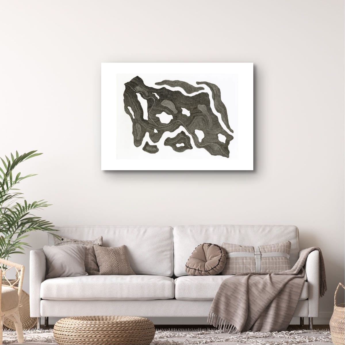 Mapping Cloudy Terrain, abstract art piece on a wall above a sofa in a living room